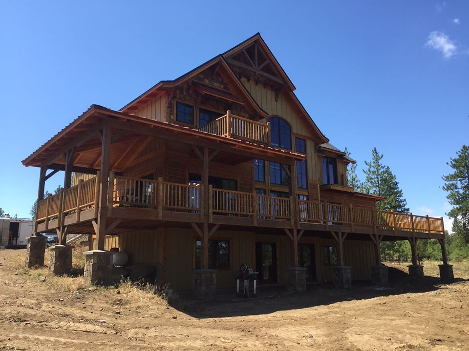 lodgepole pine handrailing wrap around deck on home