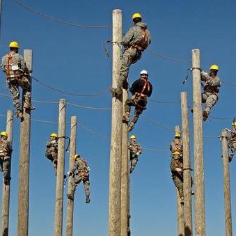 line men on class 5 utility poles